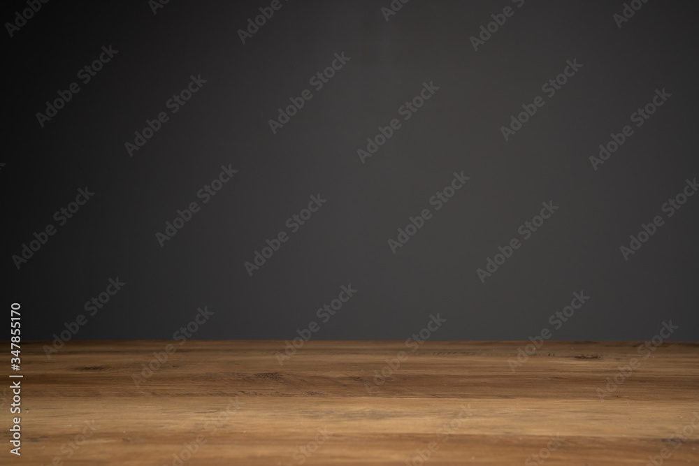 top of wooden table and dark background with copy space.