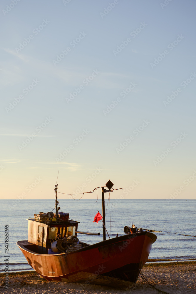 fisherman boats at sunrise time on the beach fisherman boats at sunrise time on the beach