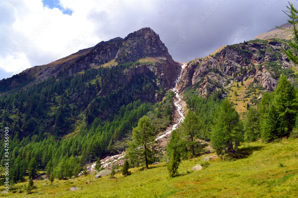 A summer landscape view of the Alps mountains in Stelvio National park, val di Pejo A summer landscape view of the Alps mountains in Stelvio National park, val di Pejo