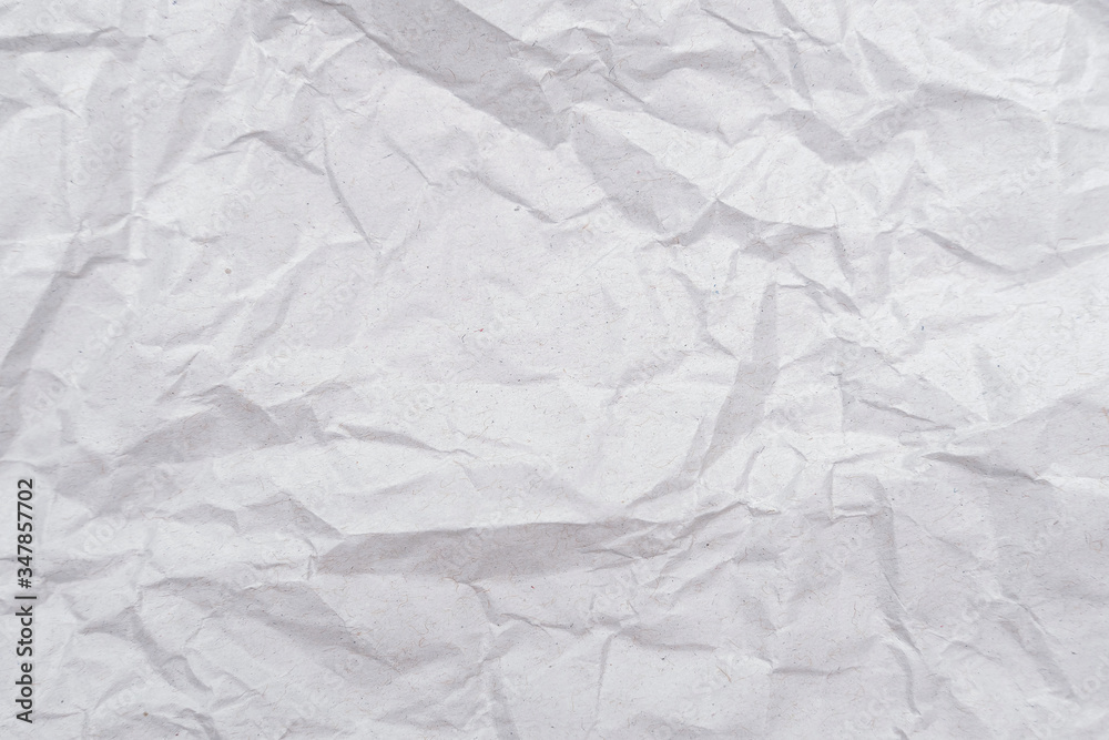 White crumpled paper texture. Abstract paper pattern for background. Close-up. White crumpled paper texture. Abstract paper pattern for background. Close-up.