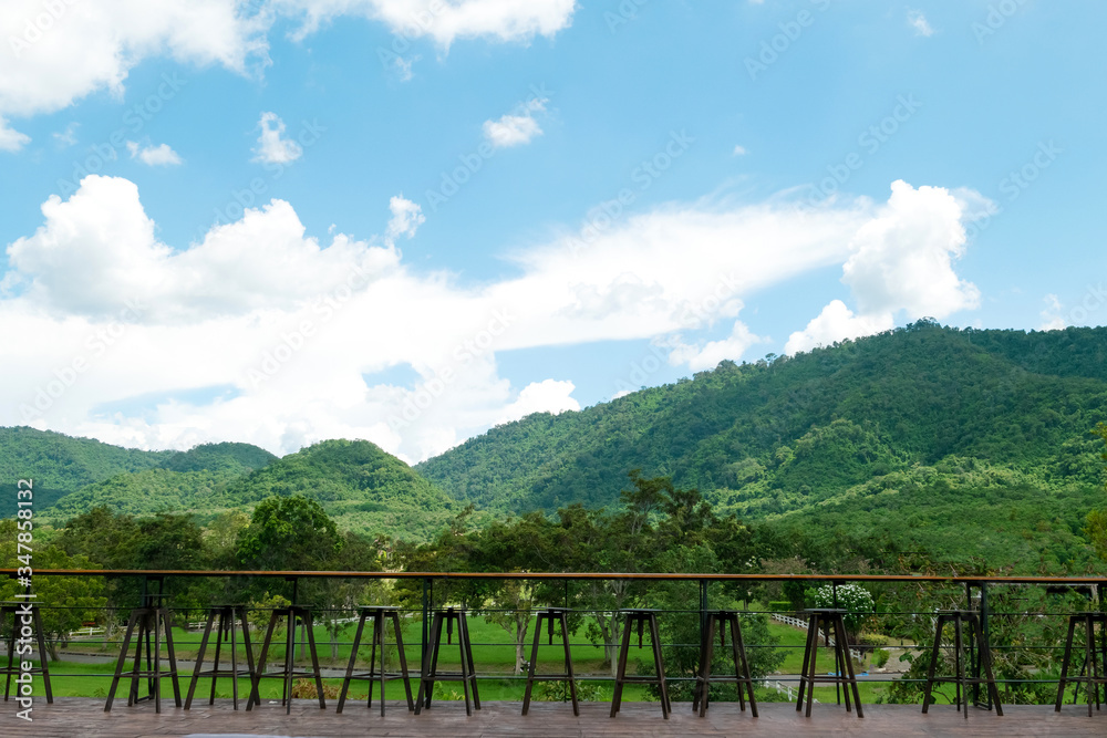 Wooden table and mountain landscape scenic of coffee shop at countryside. Wooden table and mountain landscape scenic of coffee shop at countryside.