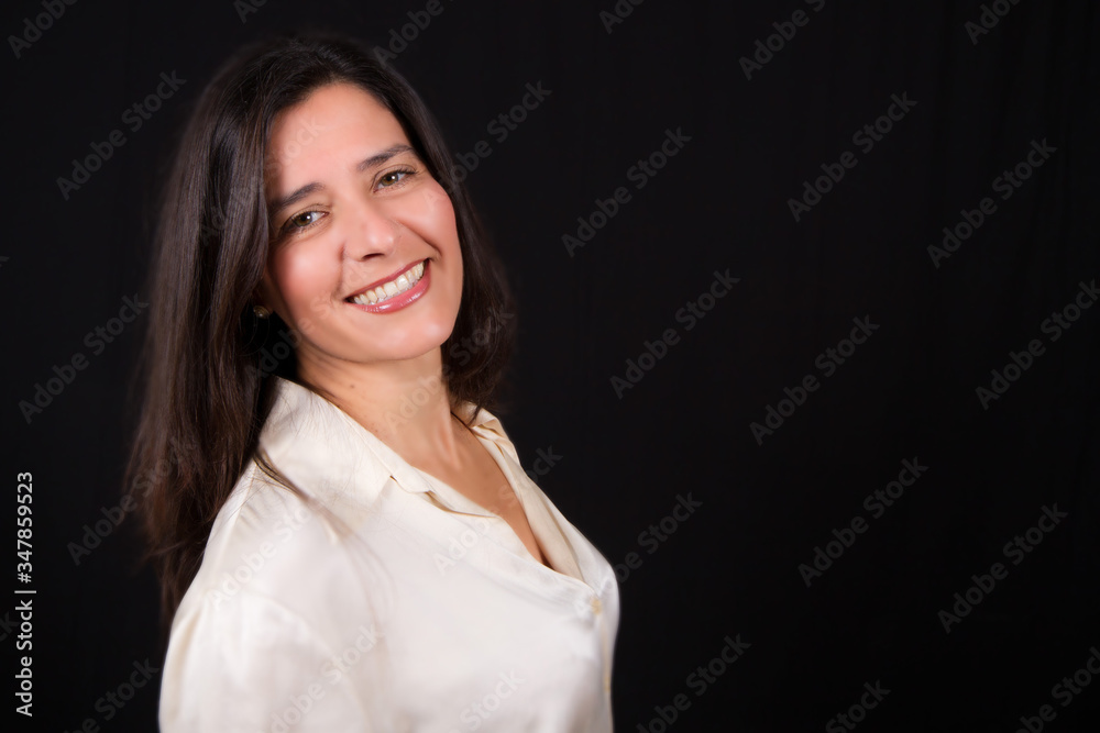 Brunette woman smile with black background in photo studio Brunette woman smile with black background in photo studio