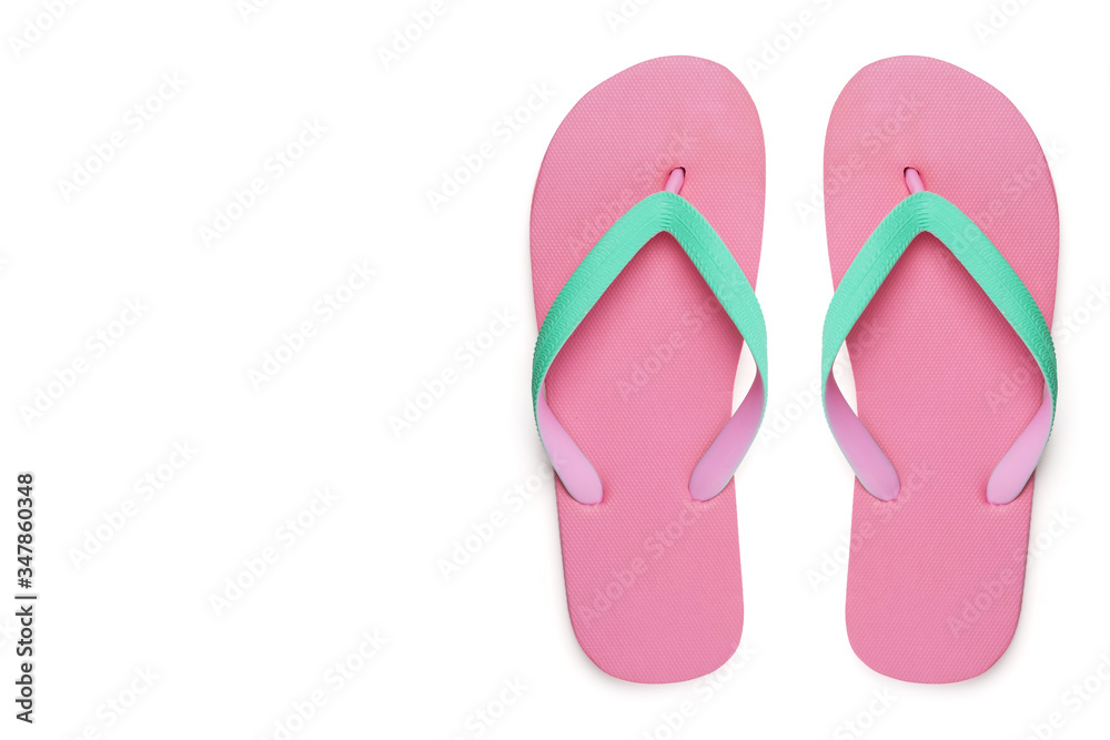 Pink flip flops or slippers isolated on white background with clipping path left copy space, top view