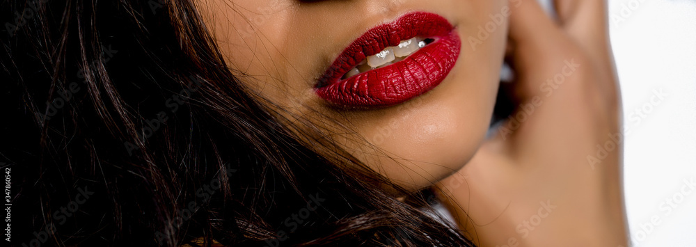 Close-up macro photo view of beautiful girl lips with red matt lipstick. Part of face, young woman. Close-up macro photo view of beautiful girl lips with red matt lipstick. Part of face, young woman.