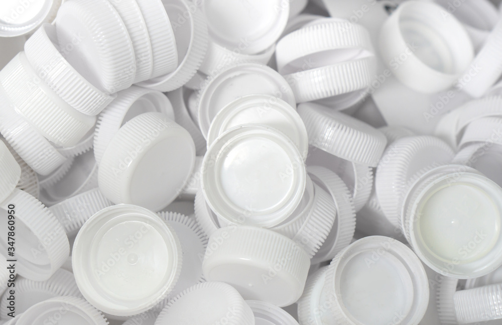 The plastic lid that is left over from the bottles are collected to be recycled into other items for reuse. The plastic lid that is left over from the bottles are collected to be recycled into other items for reuse.