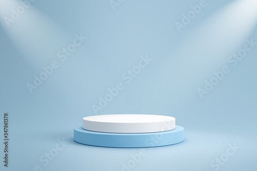 Studio template and white round shape pedestal on light blue background with spotlight product shelf. Blank studio podium for product advertising. 3D rendering. photo