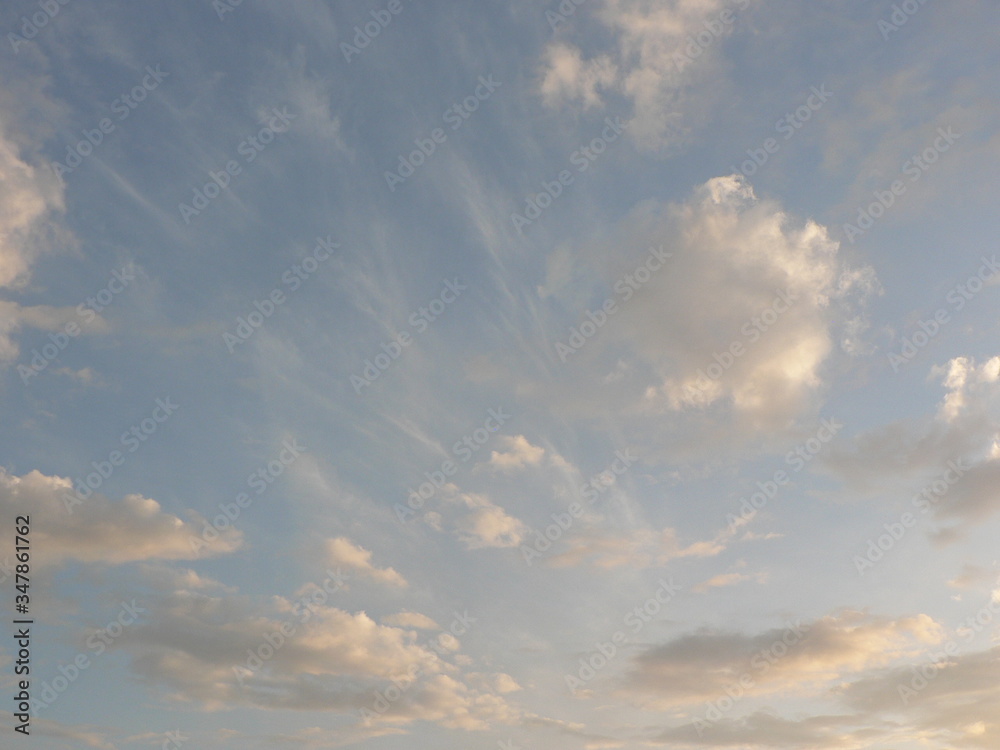 Beautiful blue sky with clouds background. Sky clouds. Air and fluffy clouds in the blue sky on a sunny day, background texture. Copy space. The concept of hope.