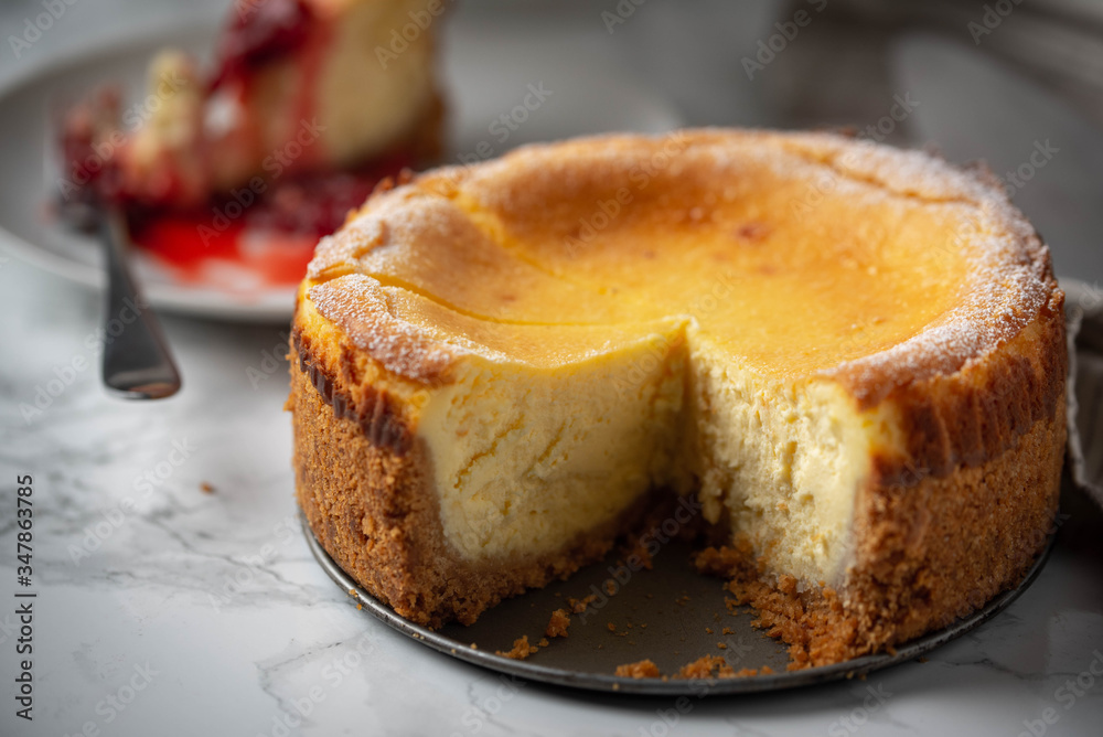 new york style cheesecake on marble background new york style cheesecake on marble background