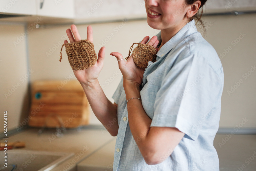 funny woman with two natural jute washcloths