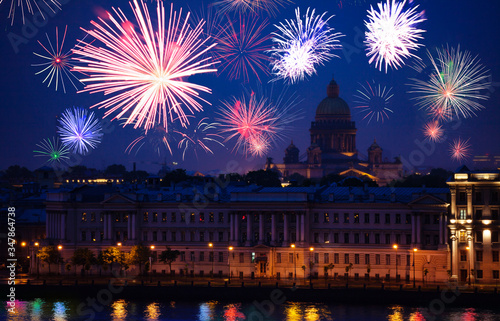St. Isaac's Cathedral over Neva river during fireworks on background Saint Petersburg, Russia