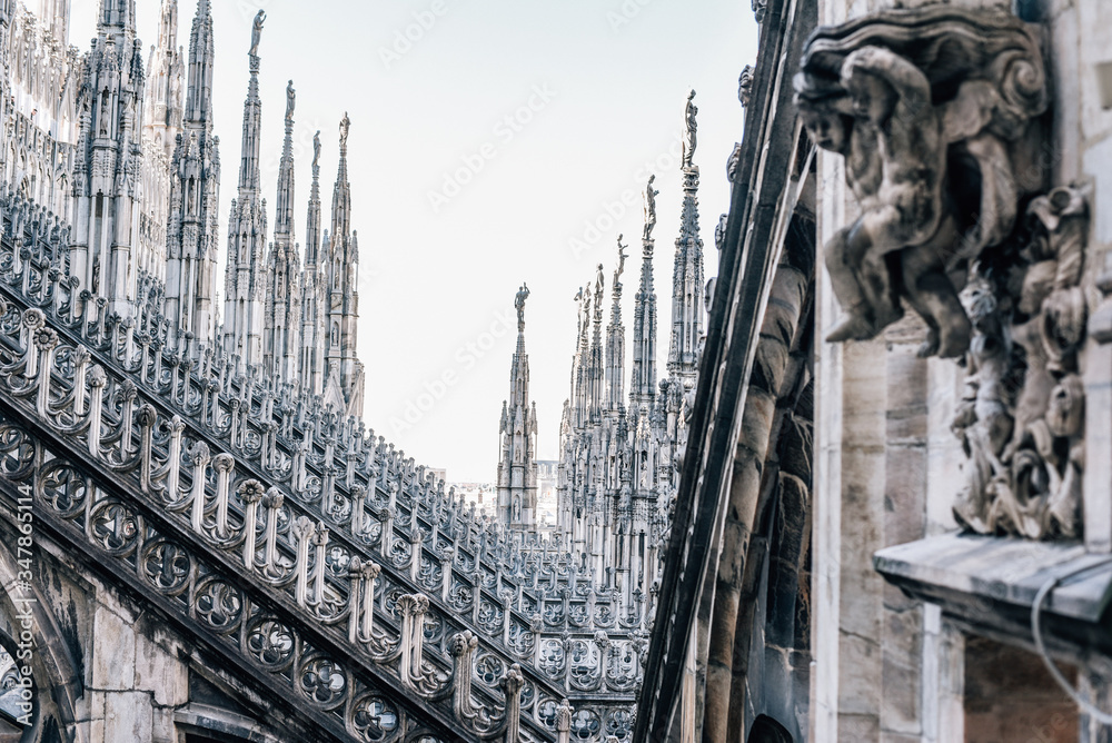 Luxurious, highly detailed statues decorated roof of the Duomo Cathedral