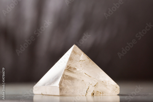 rock crystal pyramid against a dark background