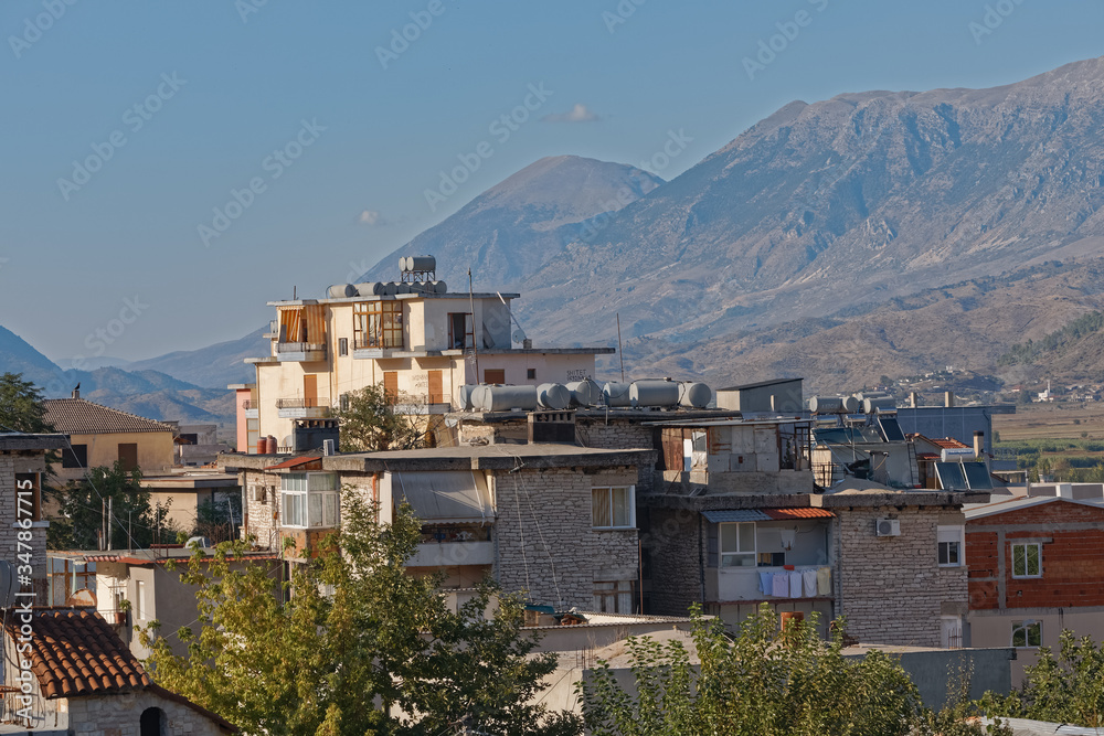 GJIROKASTER, ALBANIA - SEPTEMBER 29, 2019: Newer private houses of typical construction in old stone town built in Ottoman Turkish period in Albania.