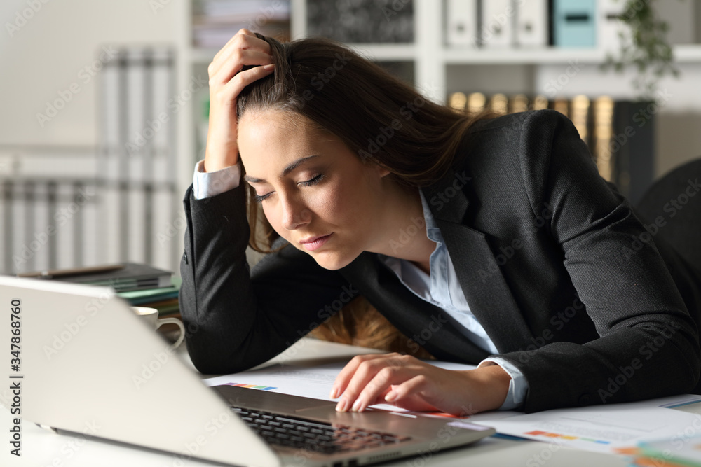 Overworked executive falling asleep at night at office Overworked executive falling asleep at night at office