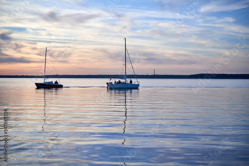Red sunset over the lake in mid-summer