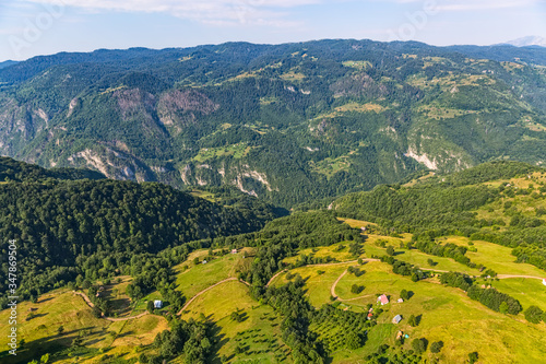Helicopter aerial photo of the summer barns for sheep and cows in mountains of the Montenegro continental part.