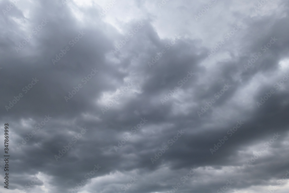 Fototapeta premium Dark storm clouds before rain used for climate background. Clouds become dark gray before raining. Dramatic background.