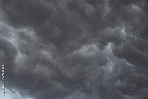 Dark storm clouds before rain used for climate background. Clouds become dark gray before raining. Dramatic background.
