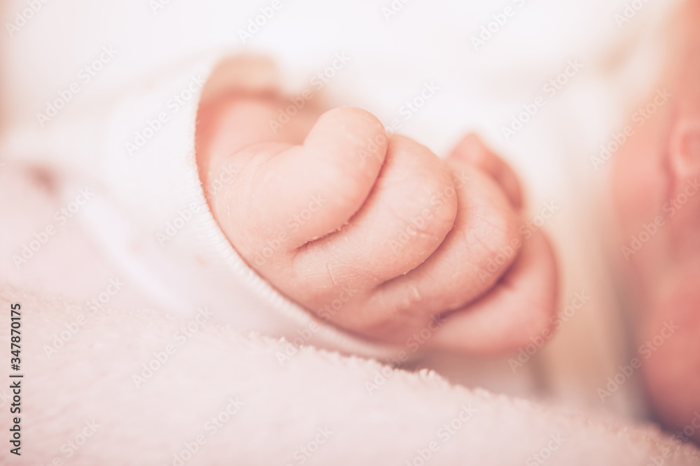 Adorable baby sleeping on stomach. Little hand of sleeping baby newborn close up. Adorable baby sleeping on stomach. Little hand of sleeping baby newborn close up.