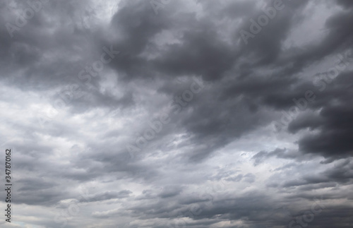 Dark storm clouds before rain used for climate background. Clouds become dark gray before raining. Dramatic background.
