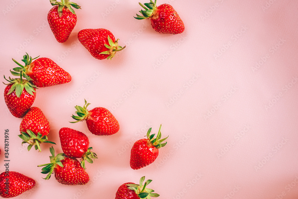 Fresh strawberry on the light pink background. View from above. Place for text. Fresh strawberry on the light pink background. View from above. Place for text.