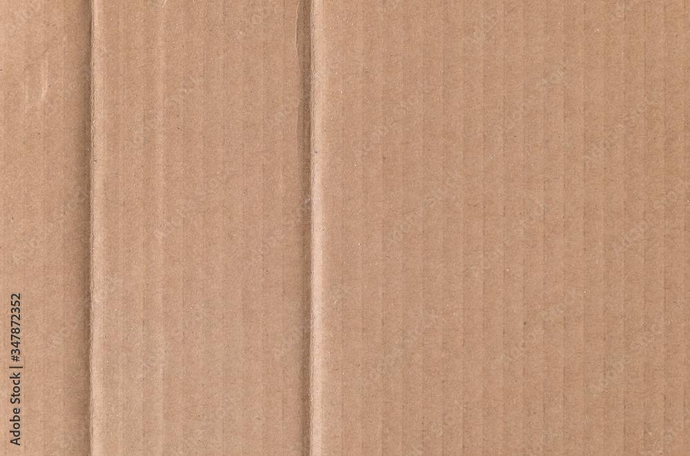Fototapeta premium Brown cardboard sheet texture background. Texture of recycle paper box in old vintage pattern background.