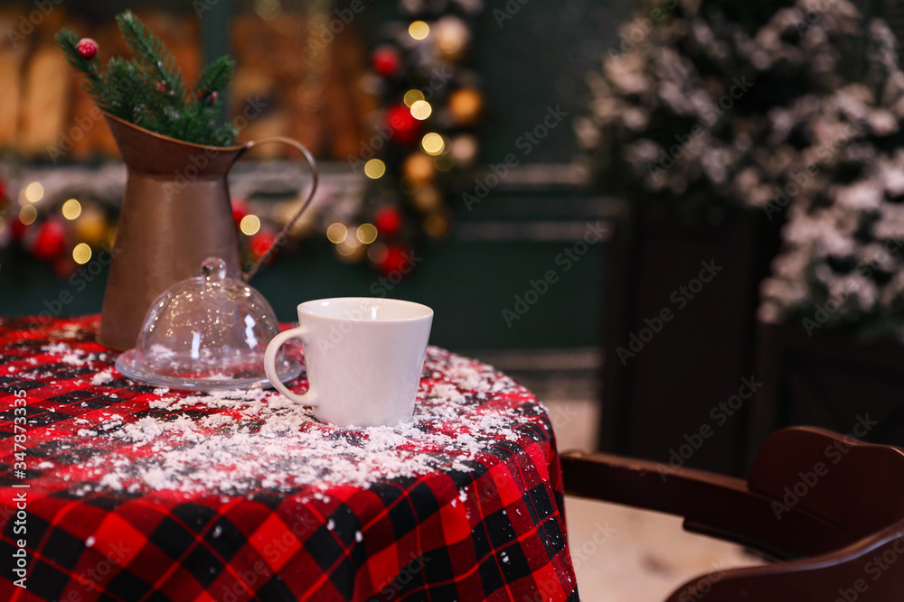 Served table in modern outdoor cafe. Christmas celebration