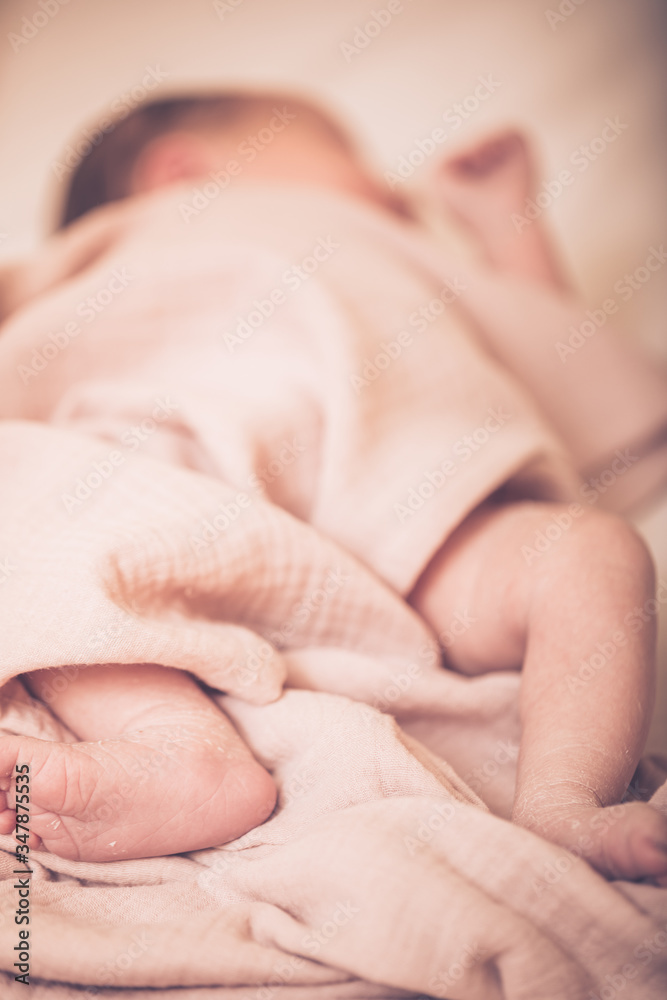 Close up picture of newborn baby feet. Sleeping newborn baby on a light blanket. Close up picture of newborn baby feet. Sleeping newborn baby on a light blanket.
