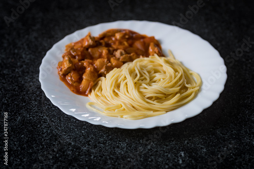 Spaghetti with pork in tomato sause