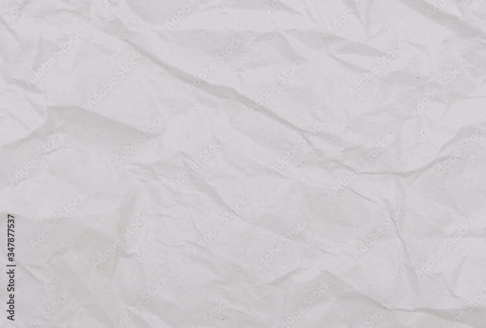 White crumpled paper texture. Abstract paper pattern for background. Close-up. White crumpled paper texture. Abstract paper pattern for background. Close-up.
