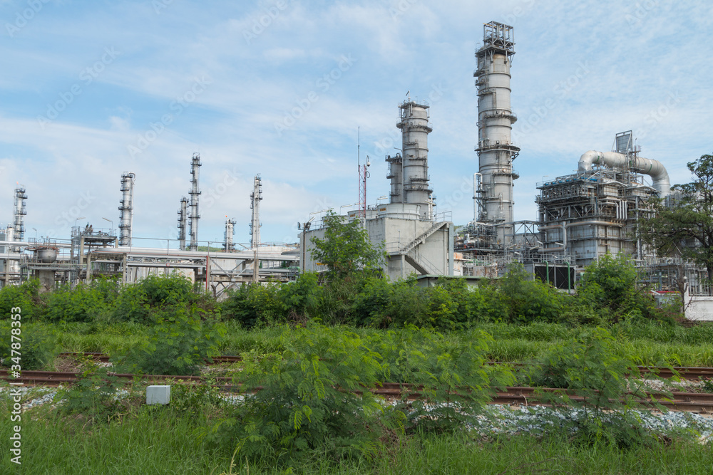Oil Refinery factory with blue sky, Petroleum, petrochemical plant Oil Refinery factory with blue sky, Petroleum, petrochemical plant