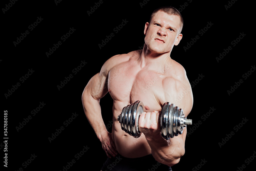 male bodybuilder with dumbbells power workout black