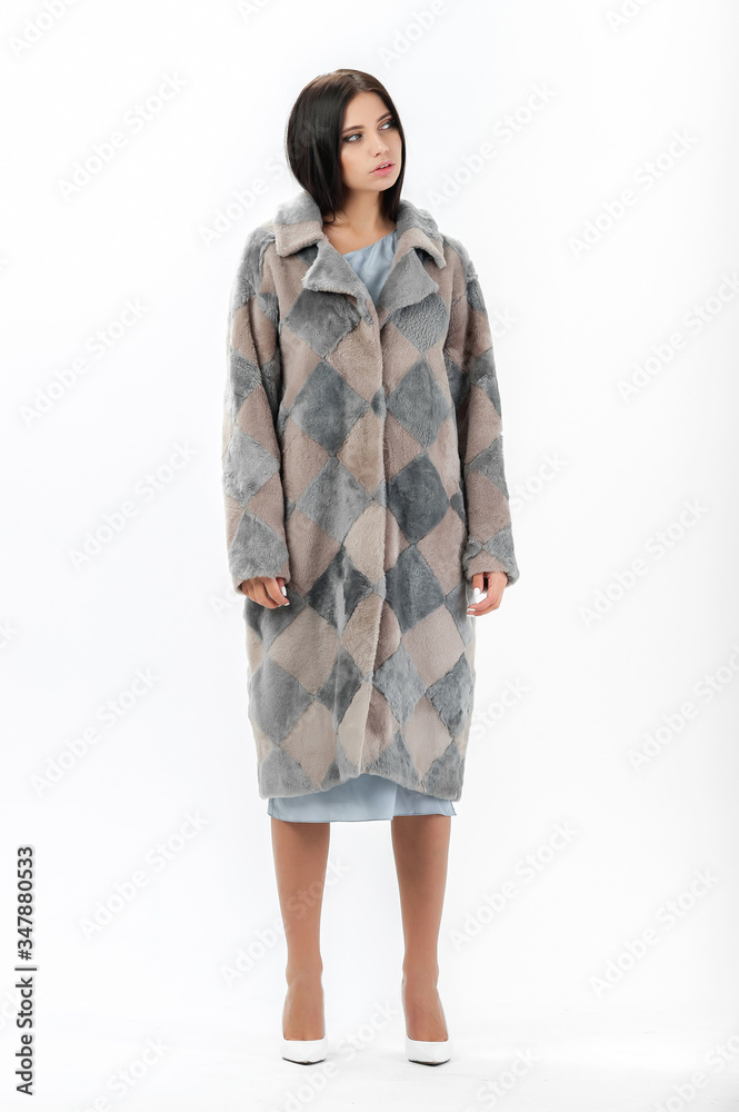 girl in a fur coat on a white background for a catalog girl in a fur coat on a white background for a catalog