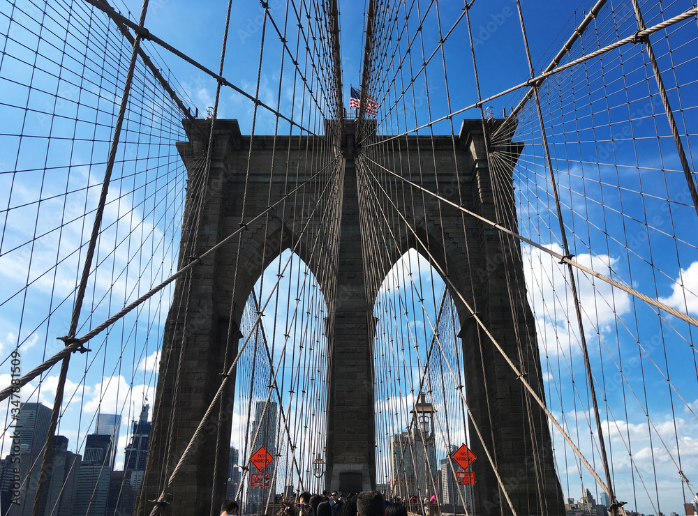 Obraz premium The Brooklyn bridge seen in detail with its steel cables.