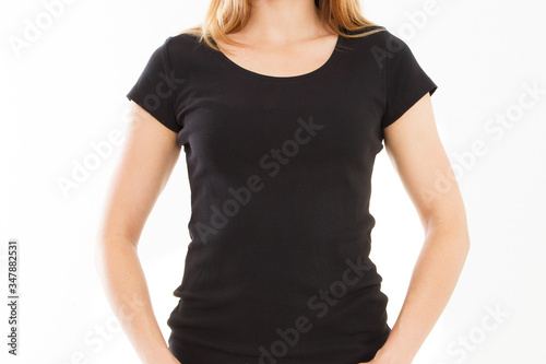 Front view black t-shirt Closeup on female body, woman girl in empty black Tshirt isolated on white background, t shirt copy space