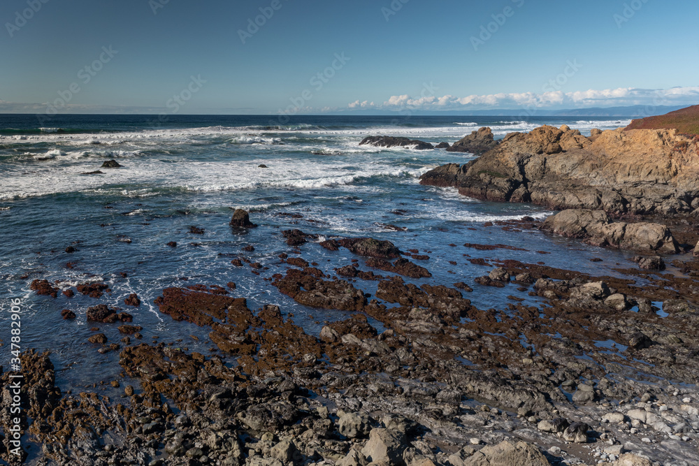 Long exposure of glass beach area in Mendocino, California, USA, Glass Beach area, featuring rocky landscape and blue hues Long exposure of glass beach area in Mendocino, California, USA, Glass Beach area, featuring rocky landscape and blue hues