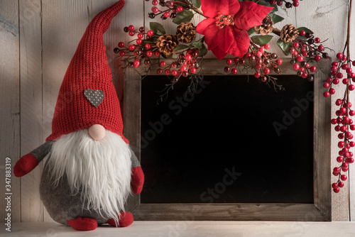 background with blackboard for Christmas texts with lights and gnomes