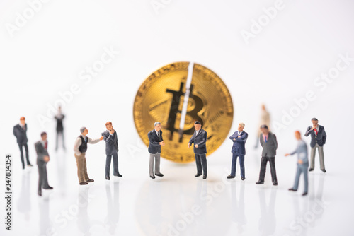 business miniature consultation meeting   Cryptocurrency bitcoin with cutting traces. sign of bitcoin halving that gennerate half of the  bitcoin from computer computing process