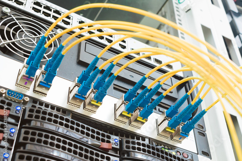 High-speed data transfer in a fiber-optic network. Communication equipment in the server room of the data center. Many fiber patch cords are connected to the interfaces of Central Internet router
