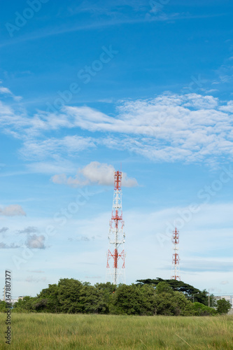 Telecommunications tower with blue sky background