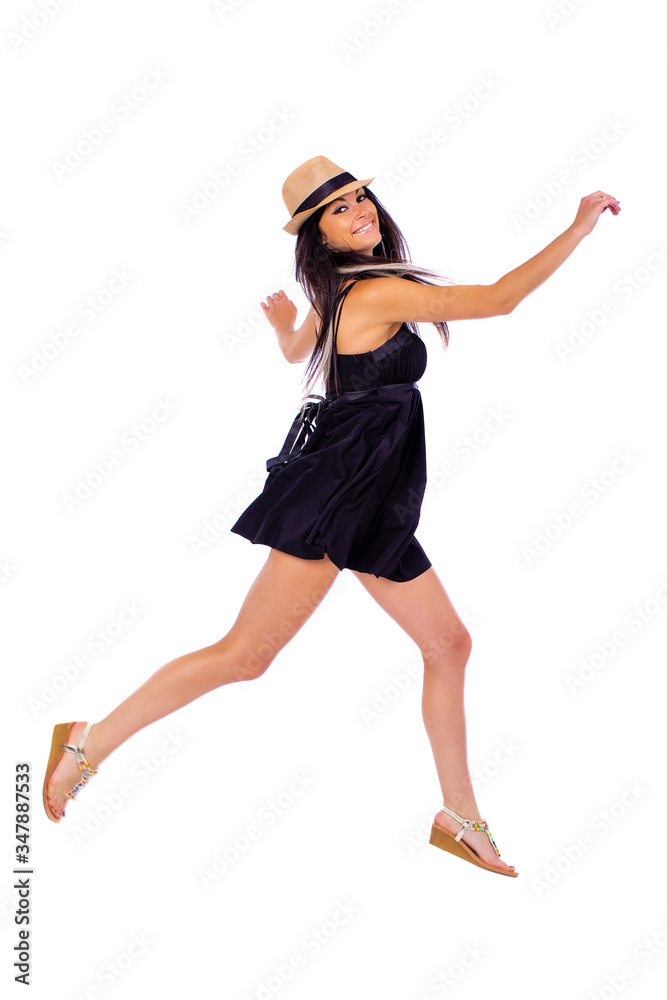 Young beautiful brunette in a black dress on a white background Young beautiful brunette in a black dress on a white background