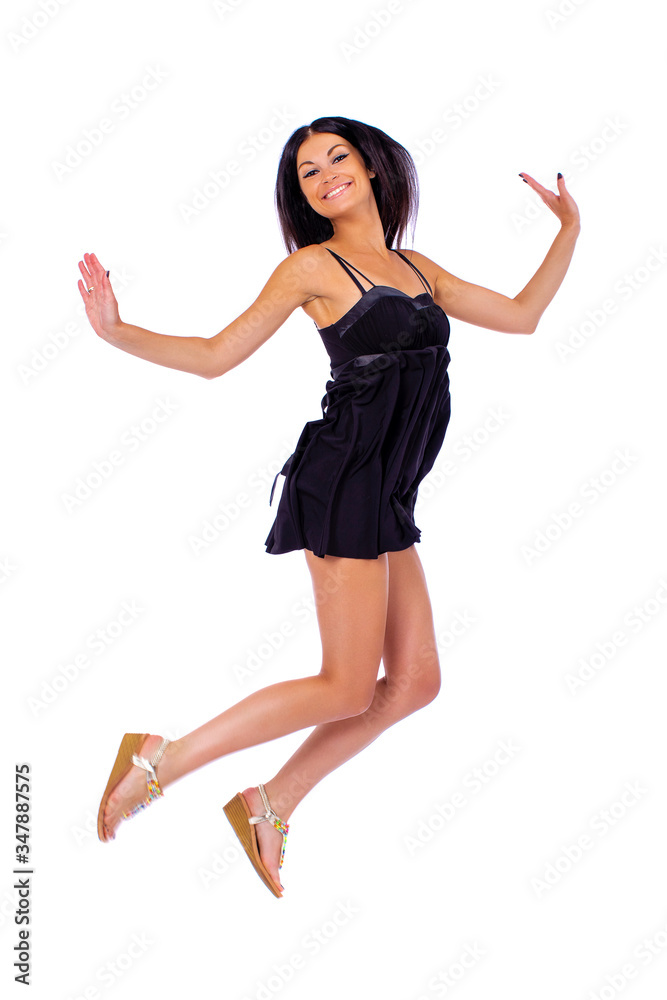Young beautiful brunette in a black dress on a white background Young beautiful brunette in a black dress on a white background