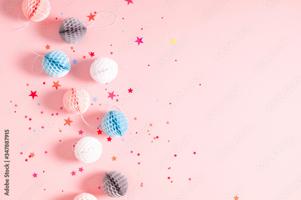 Festive pink background with confetti, paper decoration. Holiday concept on pastel pink background. Birthday, wedding, party. Flat lay, top view, copy space Festive pink background with confetti, paper decoration. Holiday concept on pastel pink background. Birthday, wedding, party. Flat lay, top view, copy space