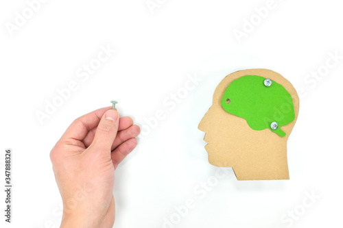 Mental health disorder and trauma rehabilitation, help, treatment, support, psychotherapy and recovery concept. Hand fixing loose screw brain.
