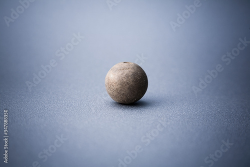 Abstract image of wooden ball on blue background.