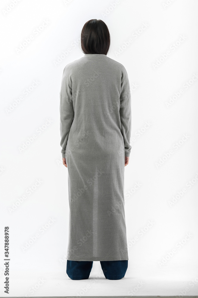brunette posing in clothes for a catalog on a white background brunette posing in clothes for a catalog on a white background