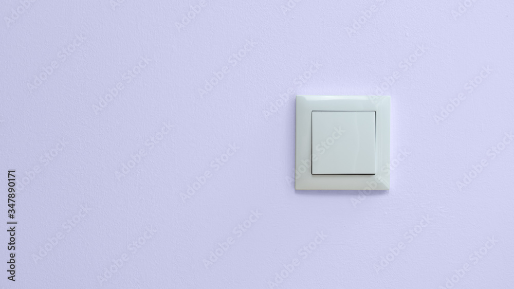 Magenta wall with white light switch and copy space on left. Magenta wall with white light switch and copy space on left.