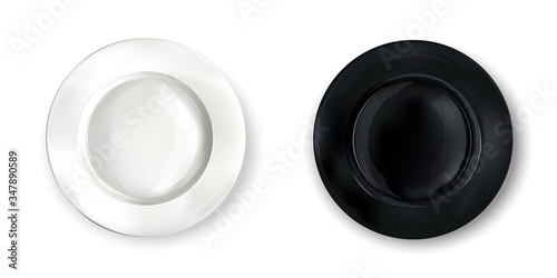 Two empty round plates - white and black.