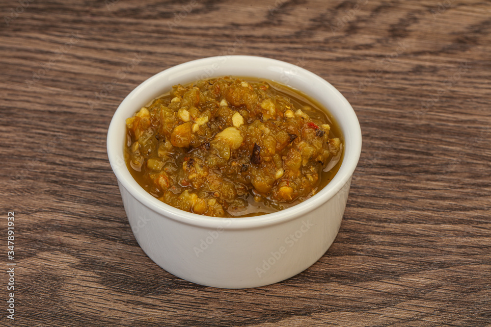 Green spicy sauce in the bowl Green spicy sauce in the bowl