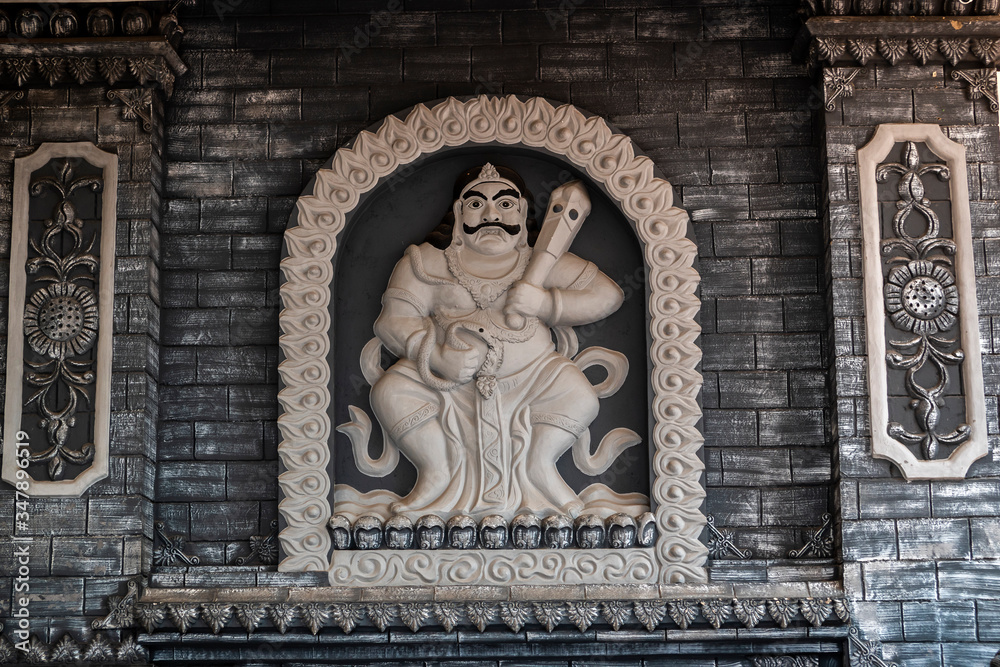 Details of a statue or wall carvings in Chinese Buddhist temple